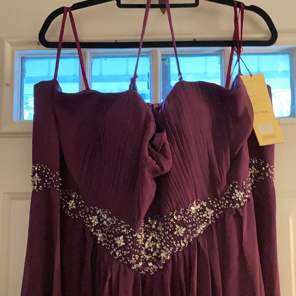 May Queen Couture strapless dress. Rhinestone and beading accents.